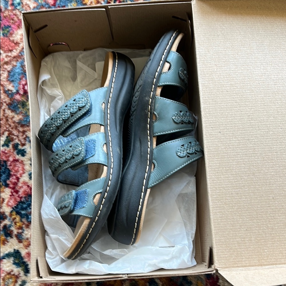 Clarks Laurien Cove Blue Grey Leather Sandals size M. 
Never worn.